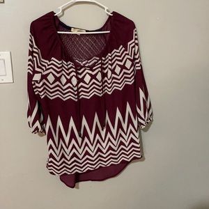 Rewind 3/4 length sleeve. Lace stitching on back. Maroon and white. Size S.